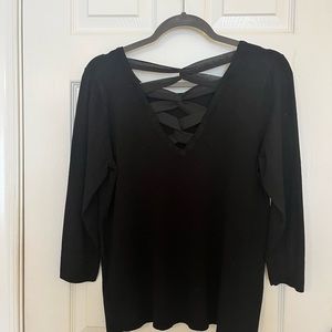 Black knit sweater with elegant cross back detail